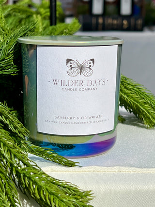 Luxury soy candle with X wood wick in a iridescent sage vessel. Bayberry & Fir Wreath scent with notes of fir, eucalyptus, bayberry, and cedarwood by Wilder Days Candle Company in Chicago.